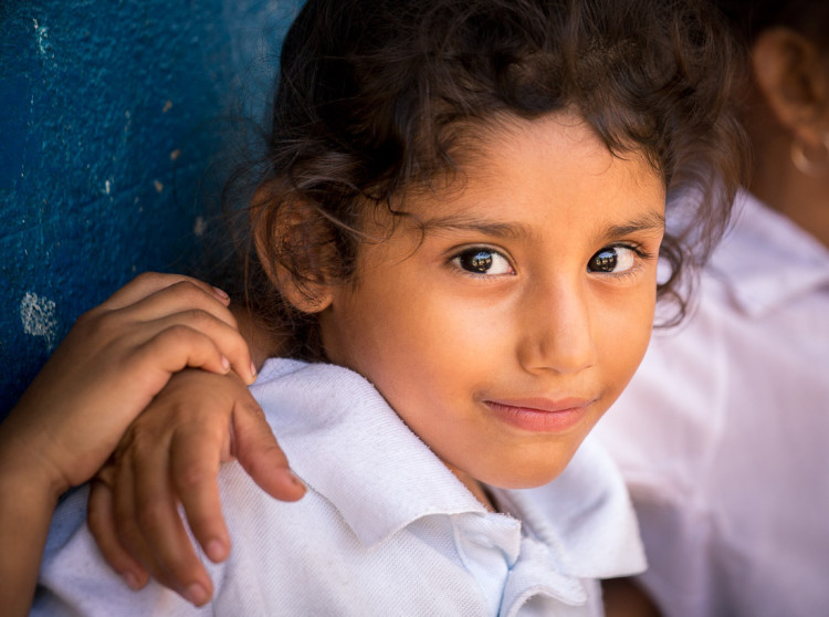 Photo of a young Nicaraguan girl after Lightroom preset applied to warm up photo