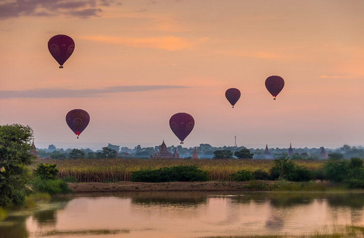 Balloons fly over Bagan in the early morning light