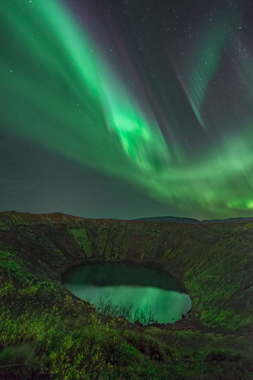 aurora borealis photo with a lake in the foreground