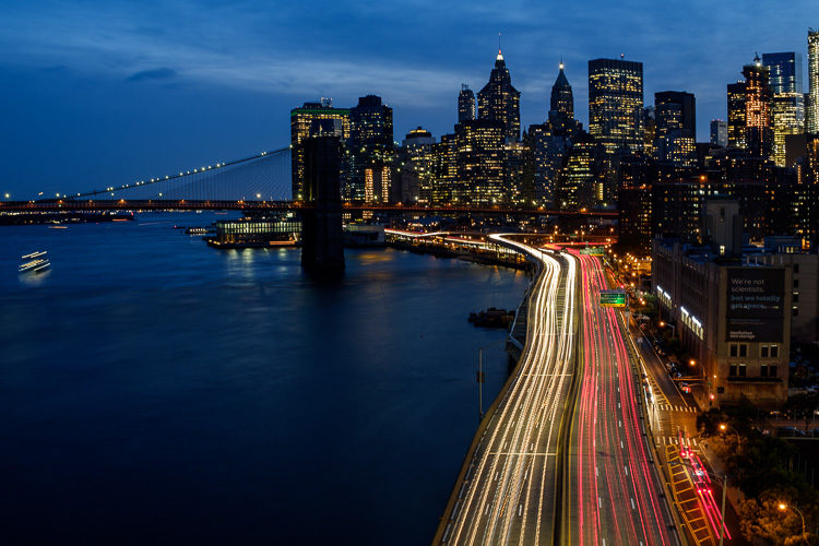 Night photo of New York during blue hour showing car light trails.  Didn't have to pack extra equipment