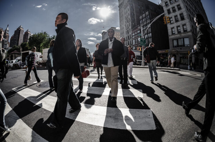 a new york city street scene using a wide angle lens to fit in more subjects