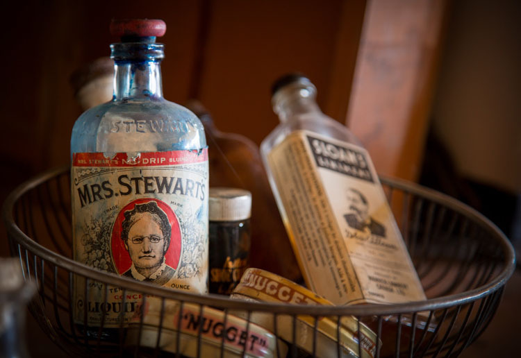 split toning example photo of antique bottles in a basket before photo