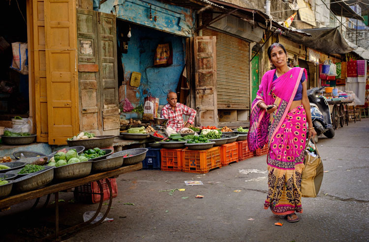 Split toning example of a woman on a street in India before photo