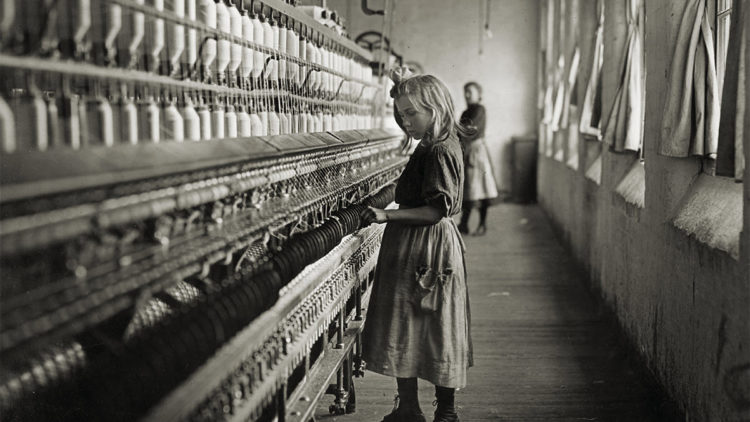 A famous photo of a child in a Carolina cotton mill by Lewis Hine in 1908