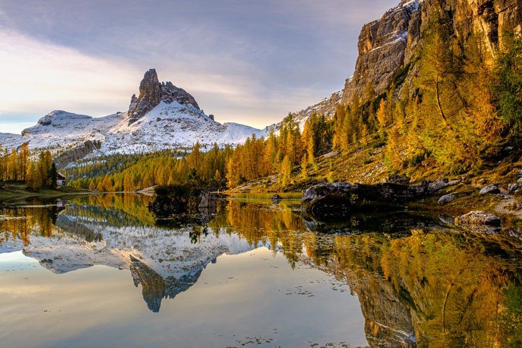 Fedara mountains of the Dolomites in Italy with reflection in the water