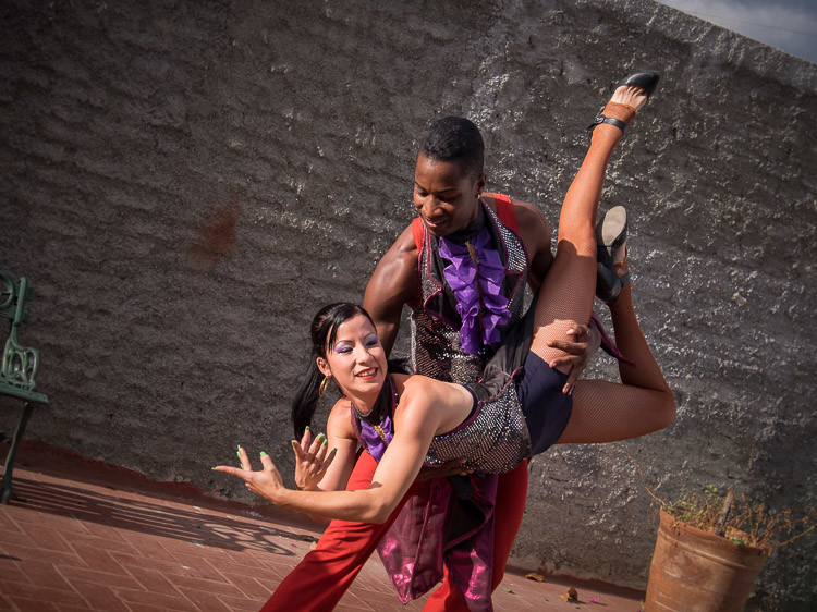a tack sharp focused photo of Cuban dancers captured while dancing using continuous focus mode