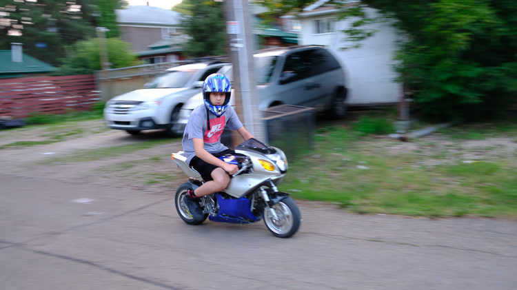 second photo in series of example image of a slow shutter speed and burst mode allowing panning of a motorcycle in motion
