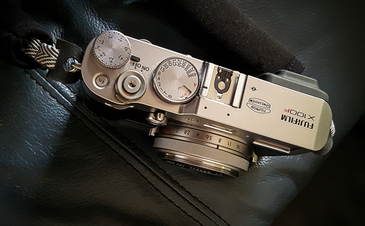 close up of the top of a Fujifilm camera buttons and settigs for camera modes. Refer to your manual as each model can be different