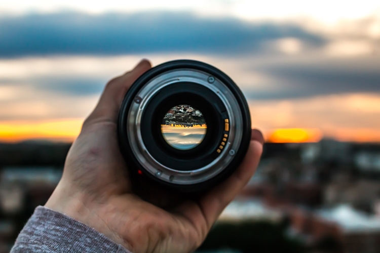 Photo of a lens with no caps on so you can see the aperture inside