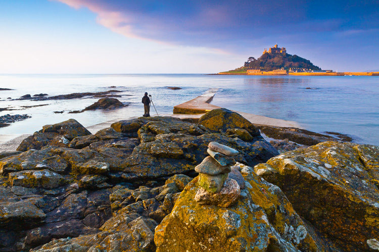 photographer and Scotland landscape with castle