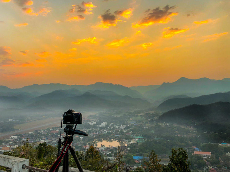 landscape photography checklist camera and tripod overlooking a scene