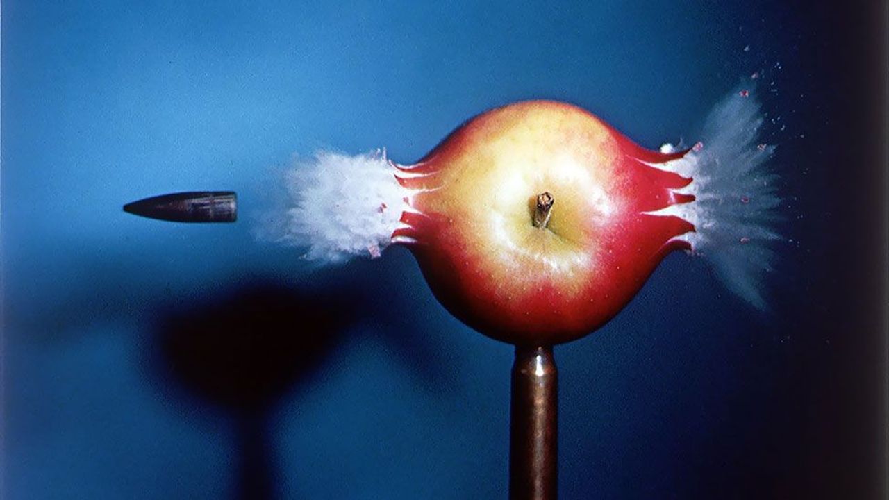 Bullet piercing an apple, 1964 by Harold Edgerton