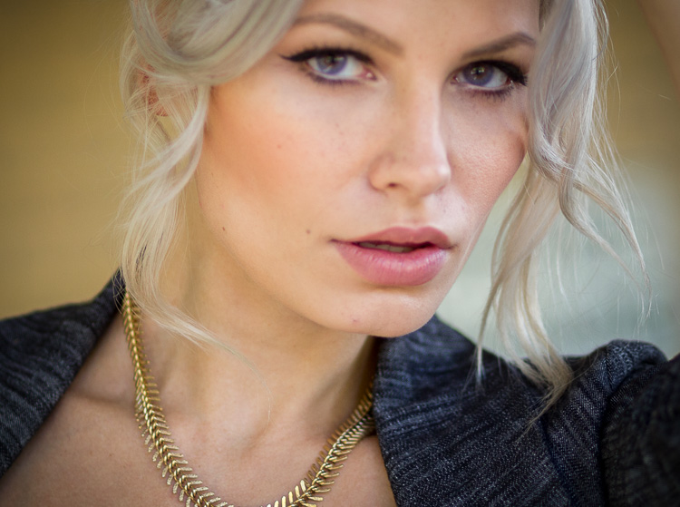 Close up you can see her eye is not in focus, her necklace and jacket lapel are. Fail! 