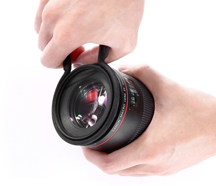 lens filter wrench accesory being used to remove a stuck filter from a lens