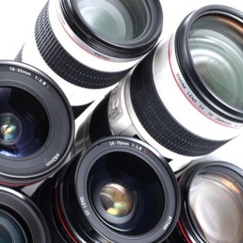 Photography equipment display showing various camera lenses