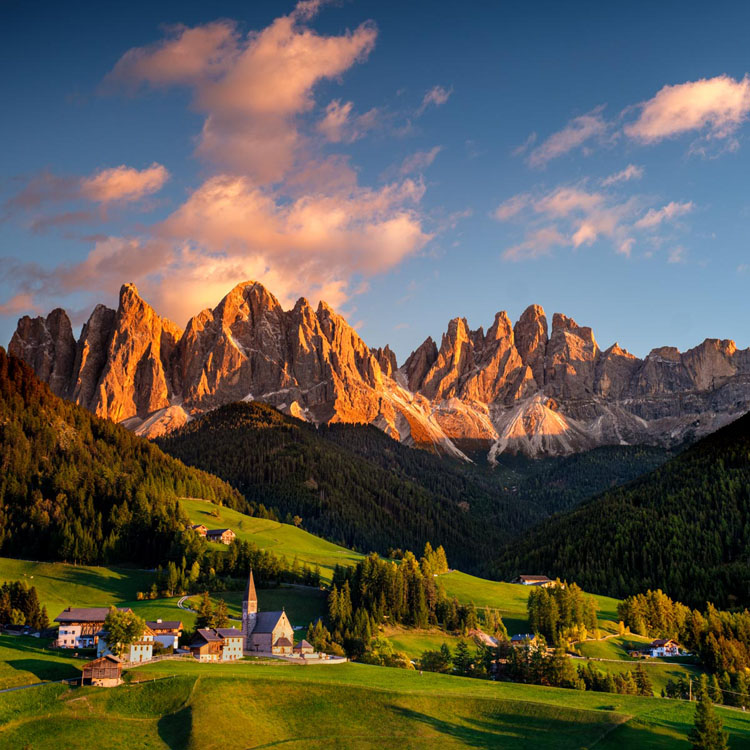The church of San Giovanni in Ranui set against the Odle