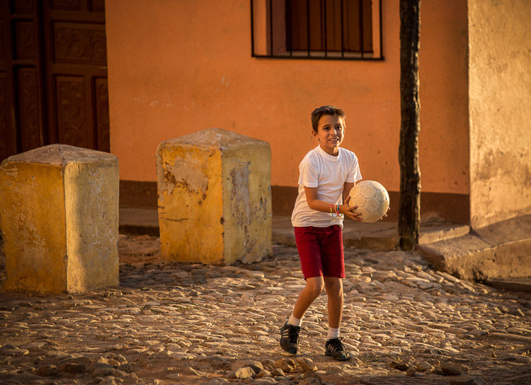 Some kids started playing soccer and I took some shots of them playing and finally - one of them stepped into that golden light!