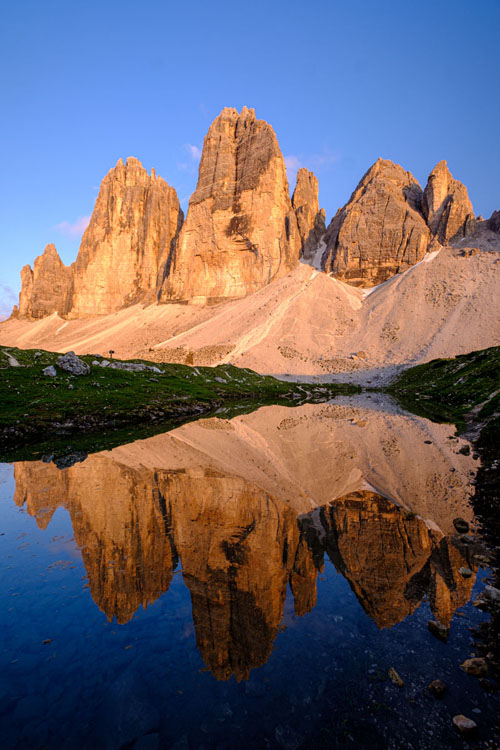 reflection of the Tre Cime mountains in the lake
