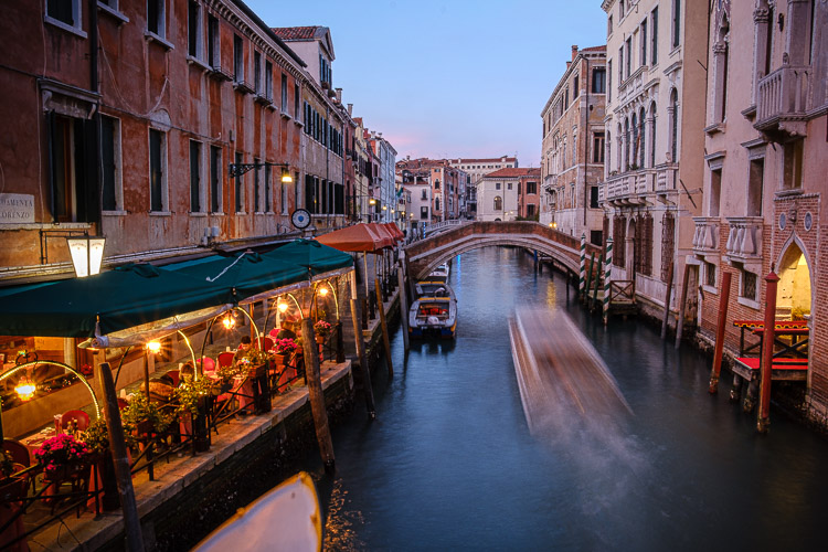boat in the venice canal at night