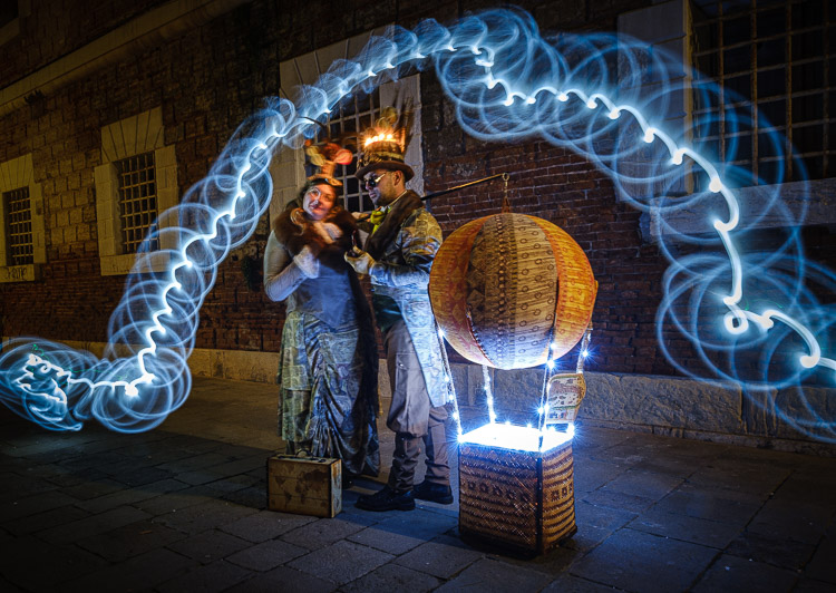 First light painting attempt with models at night showing a blue spiral effect around them