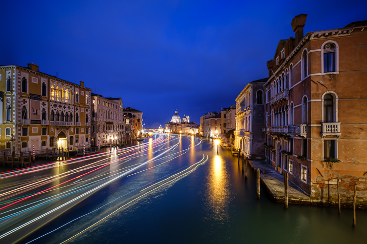 composite photo of boat light trails in a canal in venice italy combined using Photoshop
