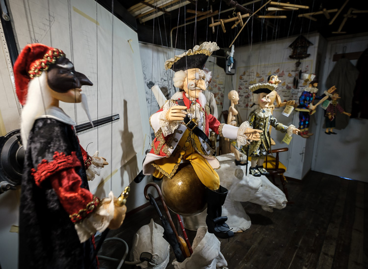 a collection of puppets on display at the puppet maker shop in Venice