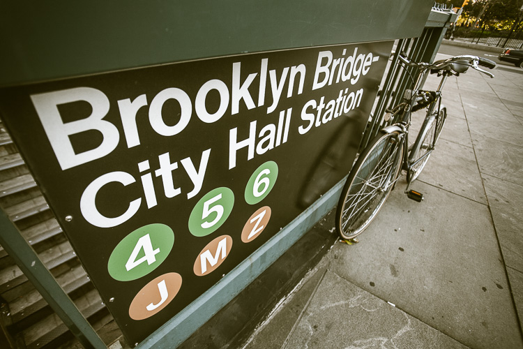 a wide angle lens with a wider field of view makes for an interesting photo of a bicycle at the subway station