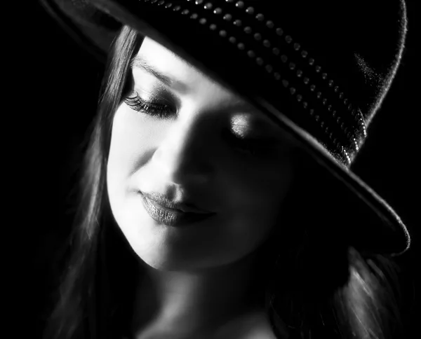 High contrast portrait photography style of a woman lit from one side and dark on the other
