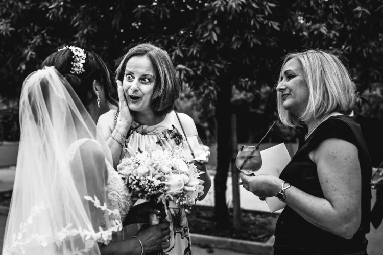 A group of women photographed outside but with black and white tones to develop a style