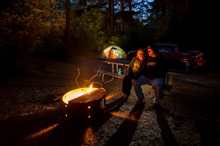 A self portrait of a couple around a fire using the camera self-timer mode and a tripod